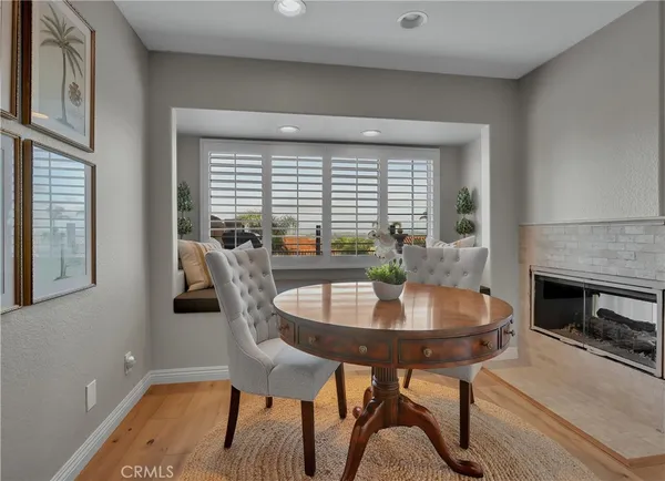 a kitchen with a sink refrigerator and dining table