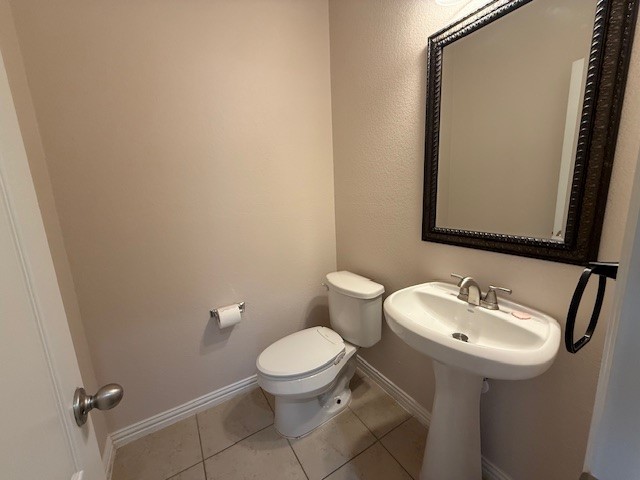 1109 Tabernash Leander, TX 78641 - Photo 12 of 23 a bathroom with a toilet sink and mirror
