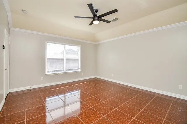 a view of an empty room with a window