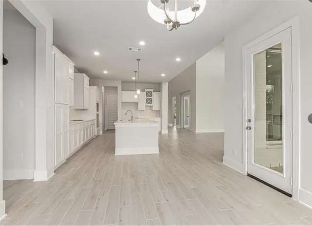 a view of kitchen with wooden floor