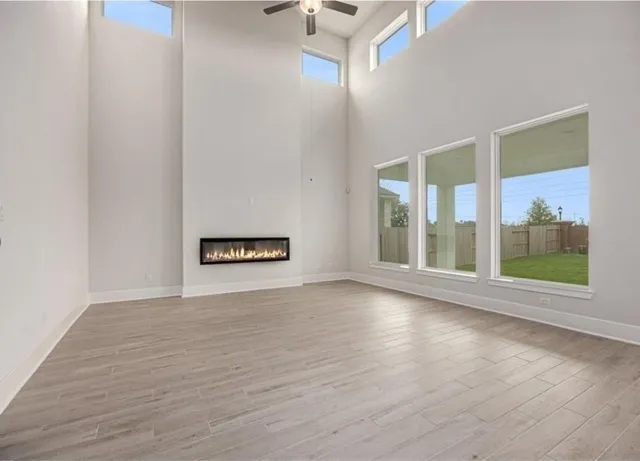 a view of an empty room with glass door