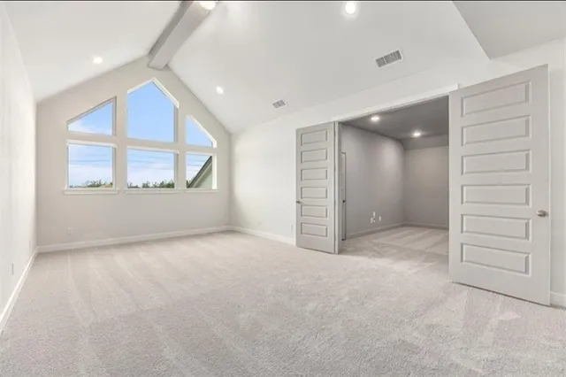 an empty room with a empty space and windows