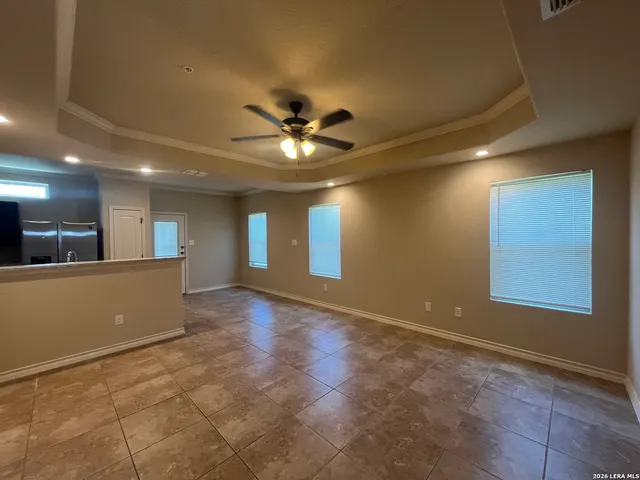 a view of an empty room with a window