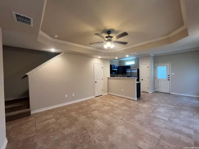 a view of a livingroom with a kitchen and a stove