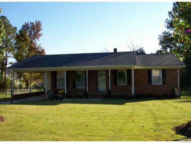 5405 Olive Road Raleigh, NC 27606 - Photo 1 of 1 a view of a house with a yard
