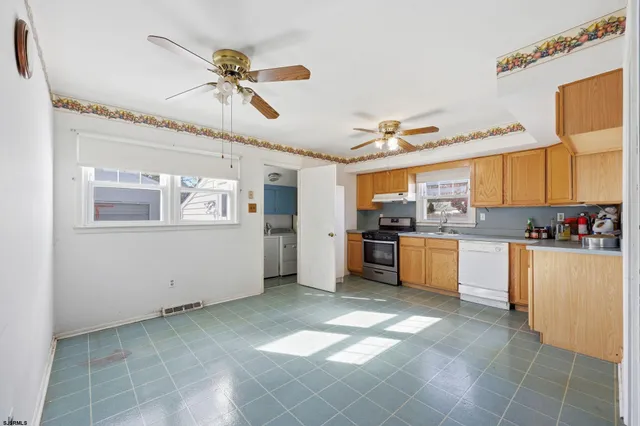 a view of a kitchen with a sink cabinets and window