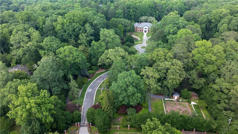 an aerial view of a house with outdoor space and street view