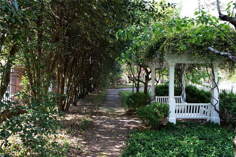 4615 Northside Drive Northwest Atlanta, GA 30327 - Photo 56 of 69 a view of a garden with plants and large trees