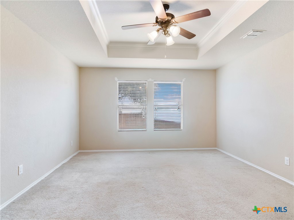 244 Cactus Patch Schertz, TX 78154 - Photo 15 of 23 an empty room with a window and a ceiling fan