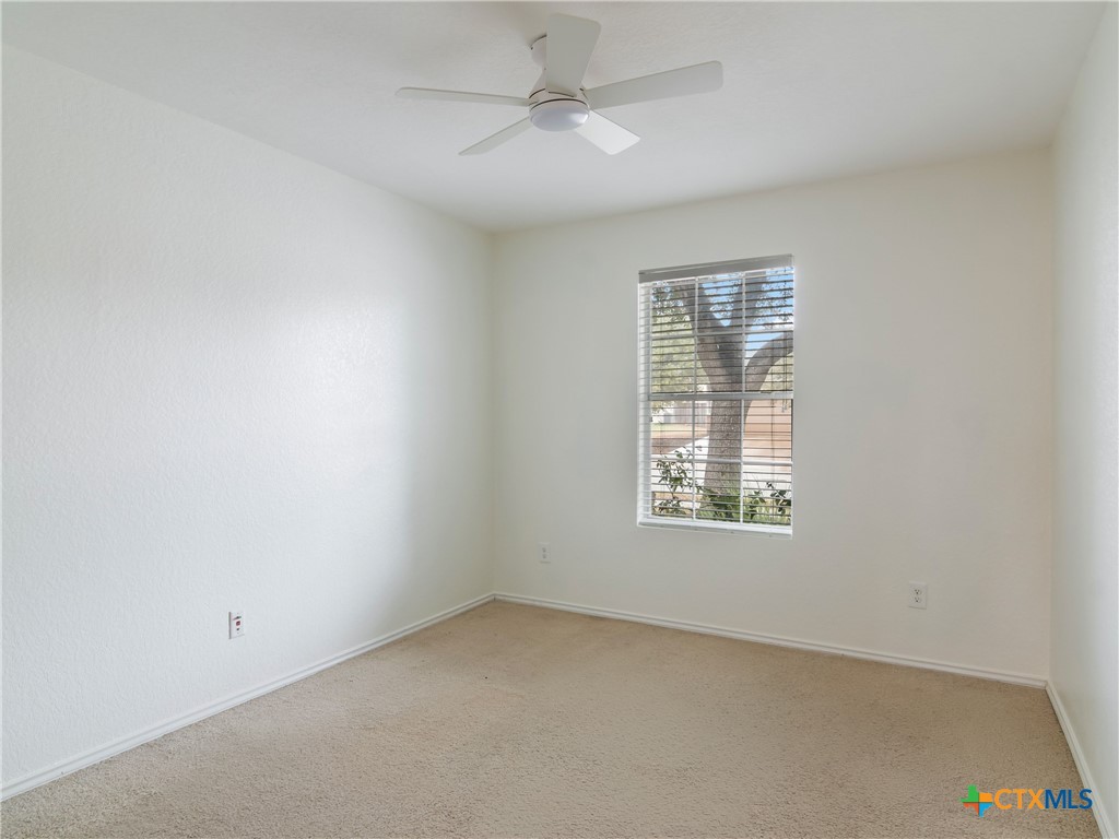 244 Cactus Patch Schertz, TX 78154 - Photo 18 of 23 an empty room with a window and a fan