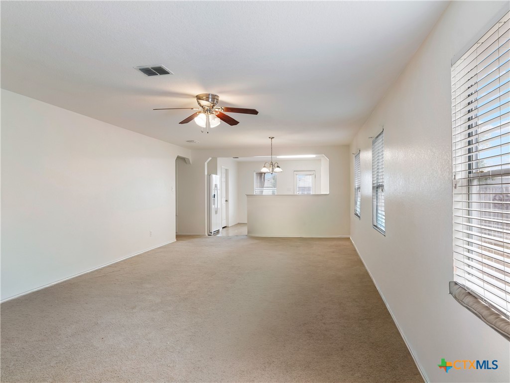 244 Cactus Patch Schertz, TX 78154 - Photo 7 of 23 a view of a livingroom with a ceiling fan and window