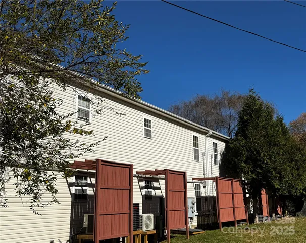 a view of a garden with wooden fence
