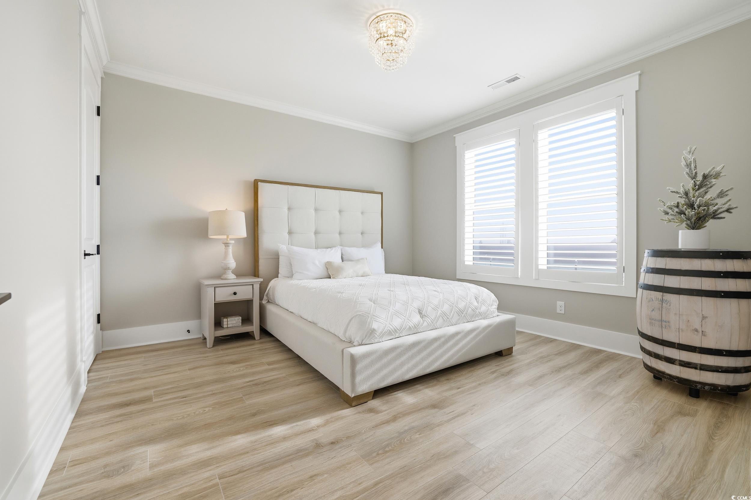 280 Bay Rdg Drive North Myrtle Beach, SC 29582 - Photo 21 of 38 Bedroom with light wood-style floors and crown molding