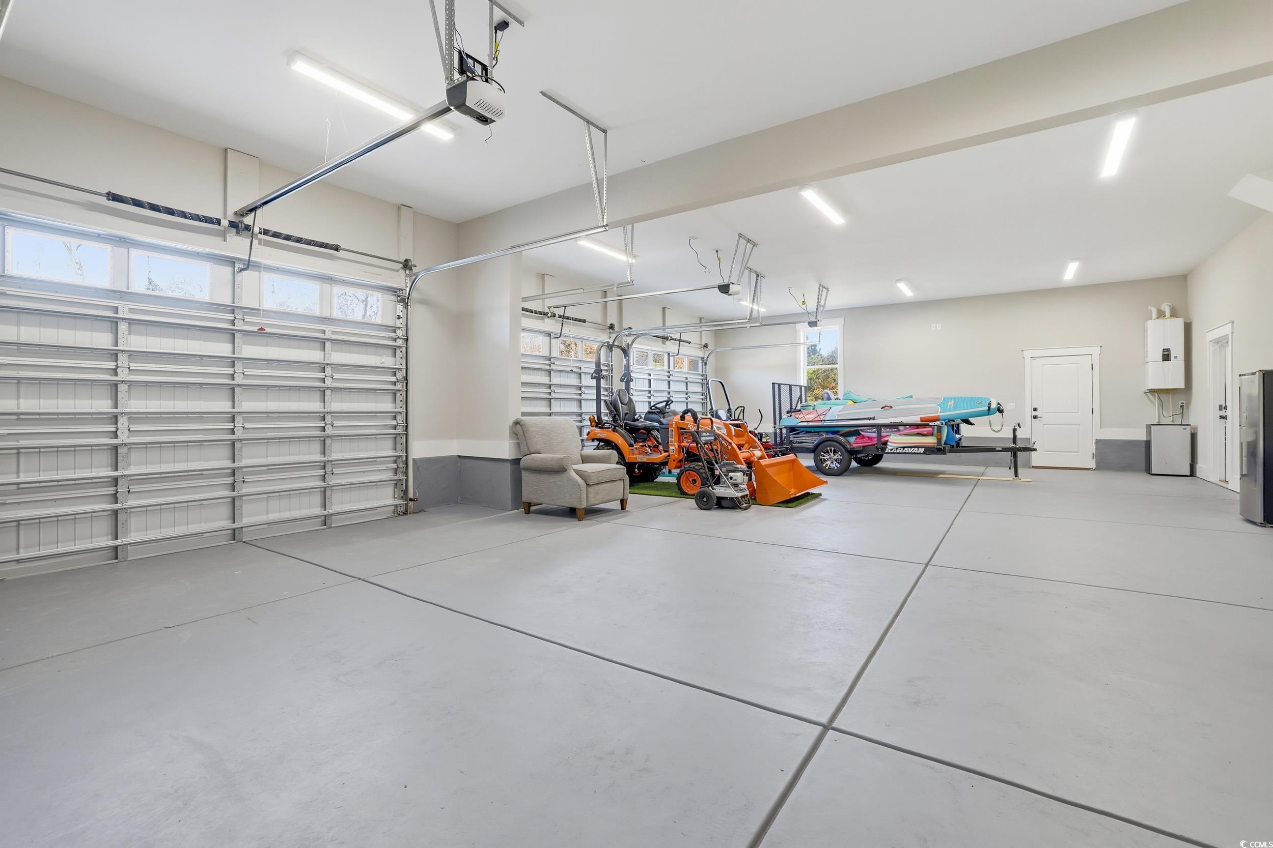 280 Bay Rdg Drive North Myrtle Beach, SC 29582 - Photo 27 of 38 Garage with water heater and a garage door opener