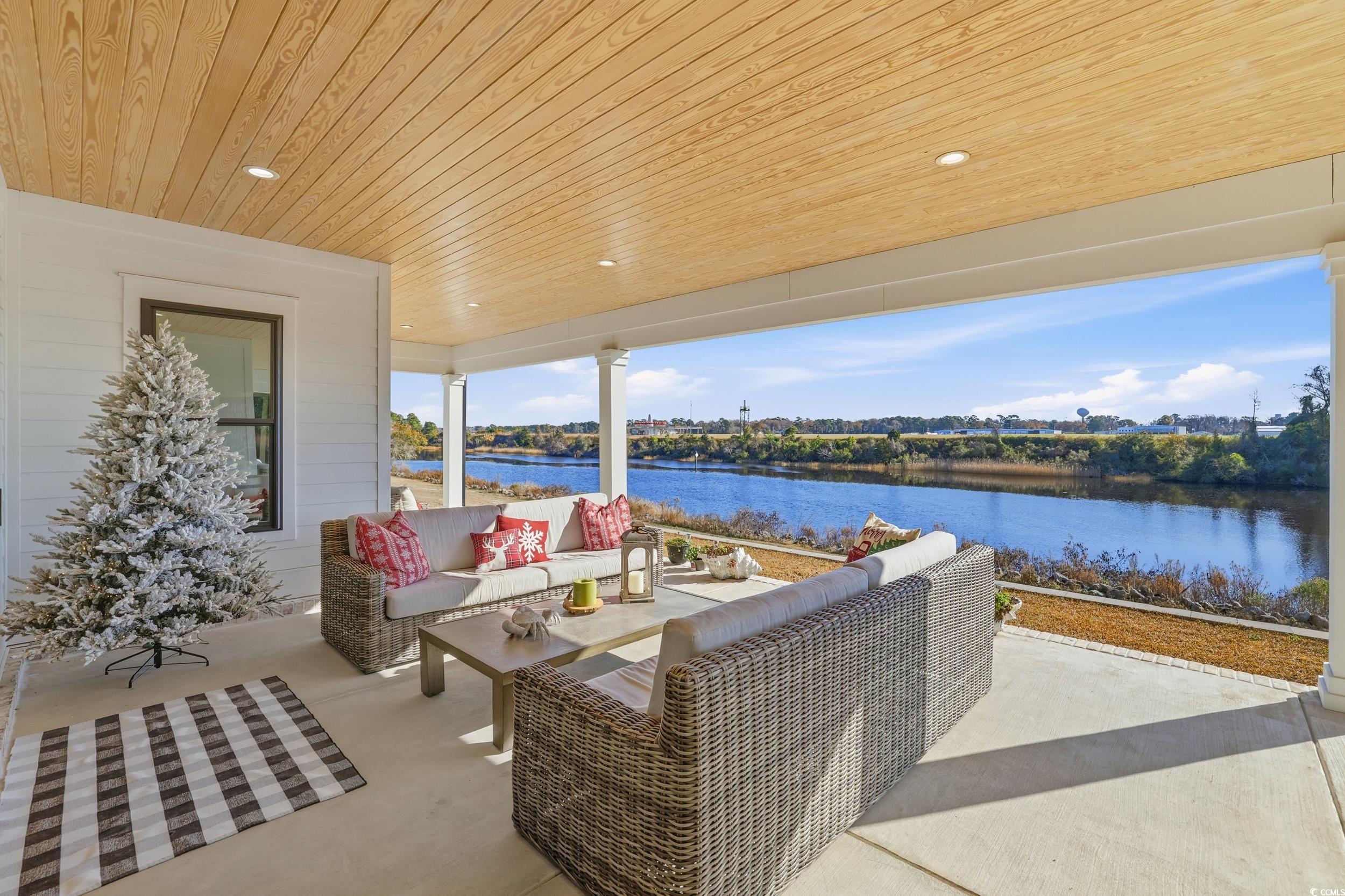 280 Bay Rdg Drive North Myrtle Beach, SC 29582 - Photo 28 of 38 View of patio / terrace with an outdoor hangout area and a water view