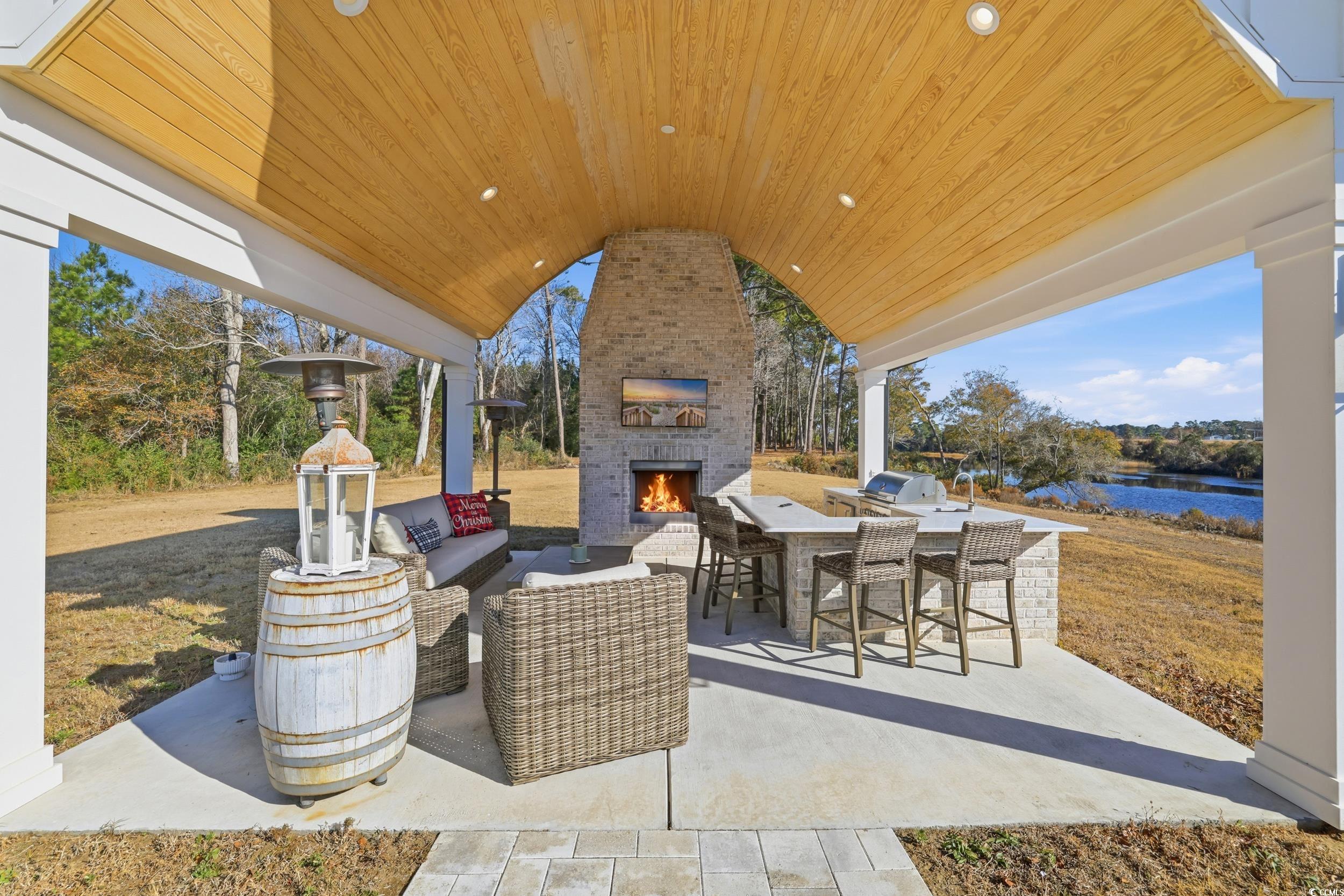 280 Bay Rdg Drive North Myrtle Beach, SC 29582 - Photo 35 of 38 View of patio / terrace with exterior kitchen and an outdoor living space with a fireplace