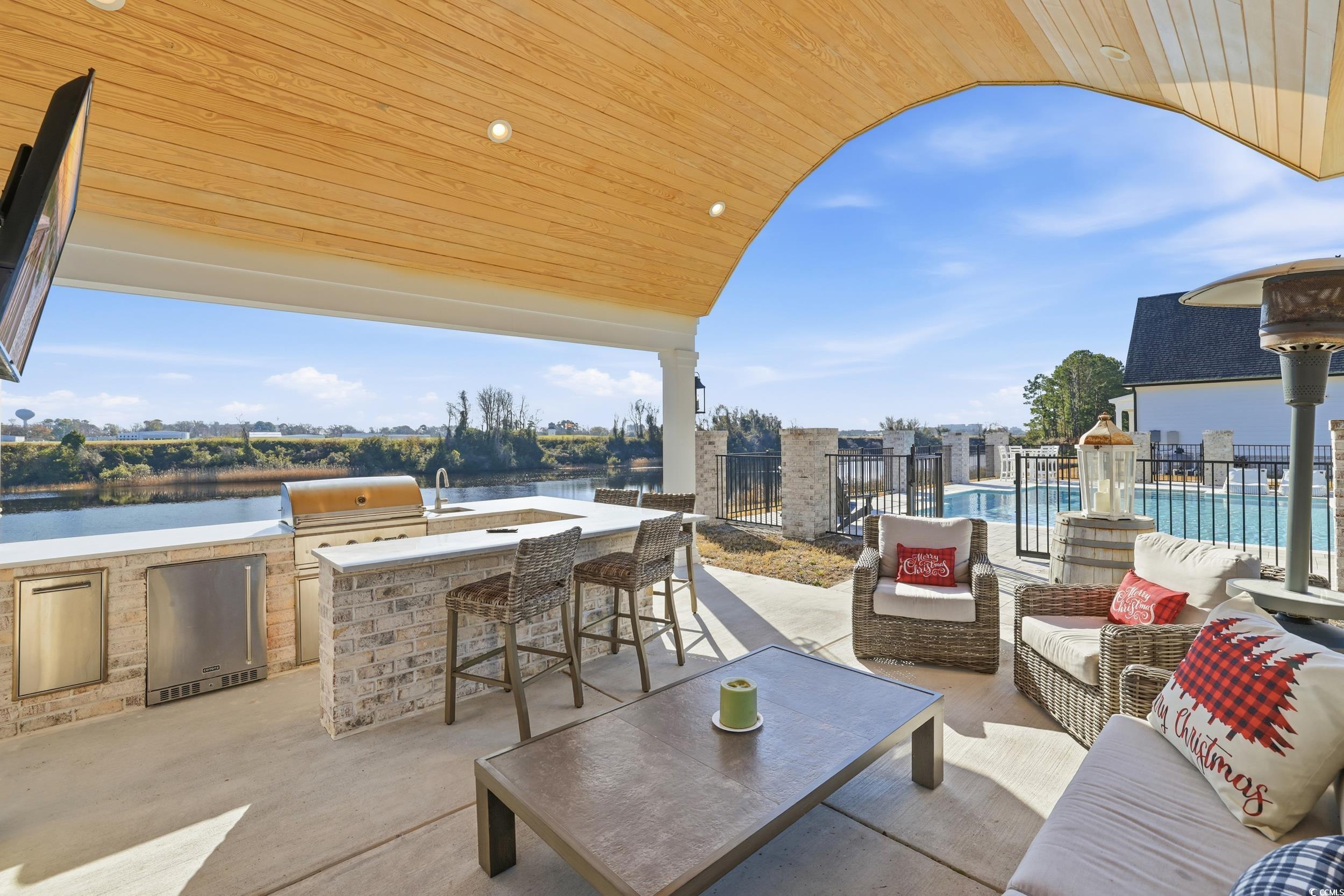 280 Bay Rdg Drive North Myrtle Beach, SC 29582 - Photo 36 of 38 View of patio / terrace with exterior kitchen, an outdoor living space, and a water view