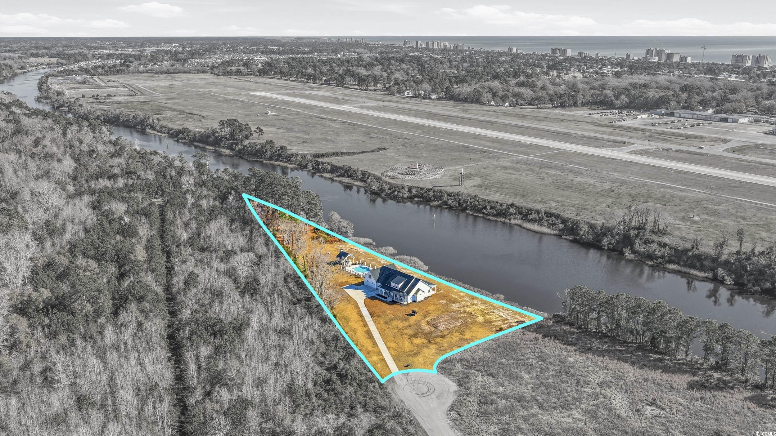 280 Bay Rdg Drive North Myrtle Beach, SC 29582 - Photo 5 of 38 Aerial overview of property's location featuring a large body of water and property parcel outlined
