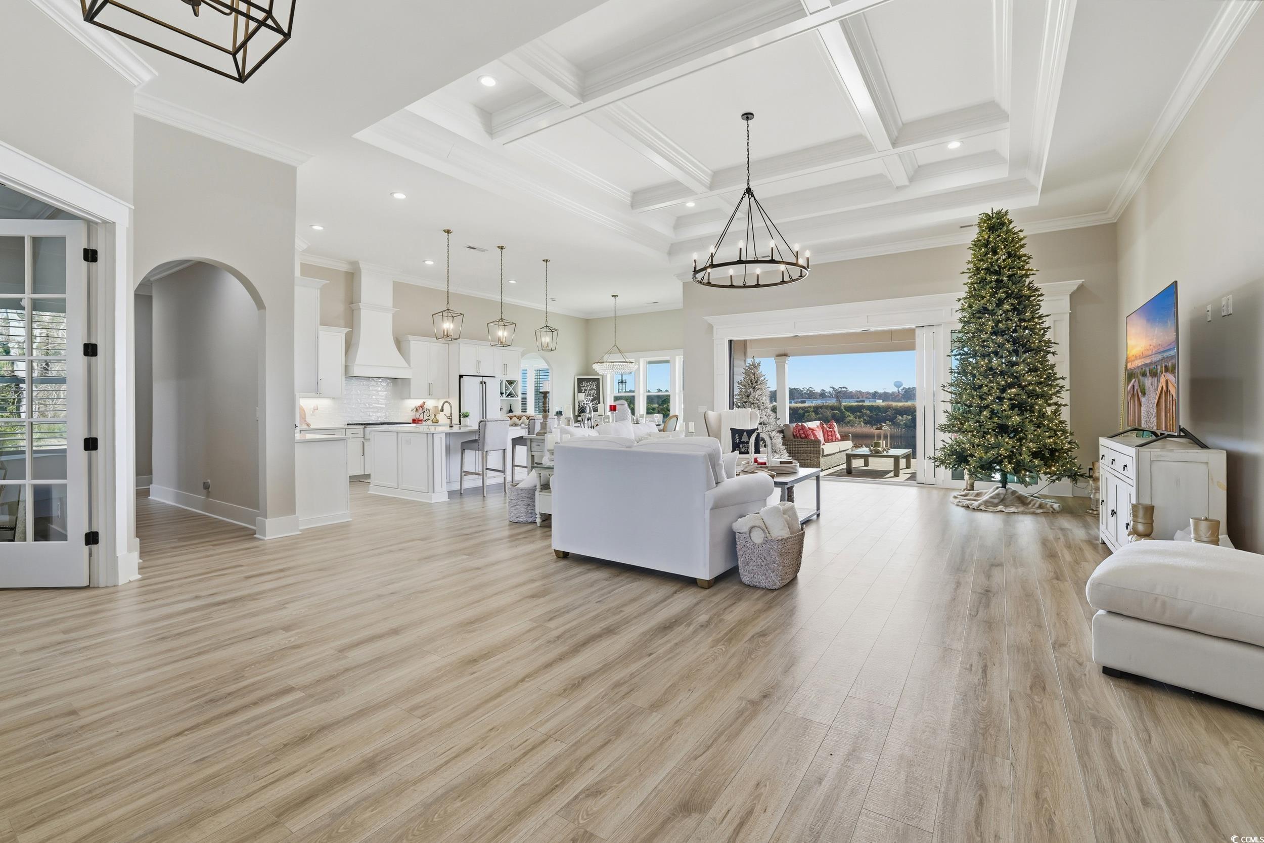 280 Bay Rdg Drive North Myrtle Beach, SC 29582 - Photo 10 of 38 Living area featuring a chandelier, coffered ceiling, a towering ceiling, light wood-type flooring, and beam ceiling