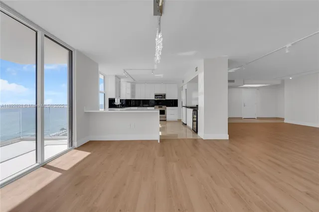 a view of kitchen with wooden floor
