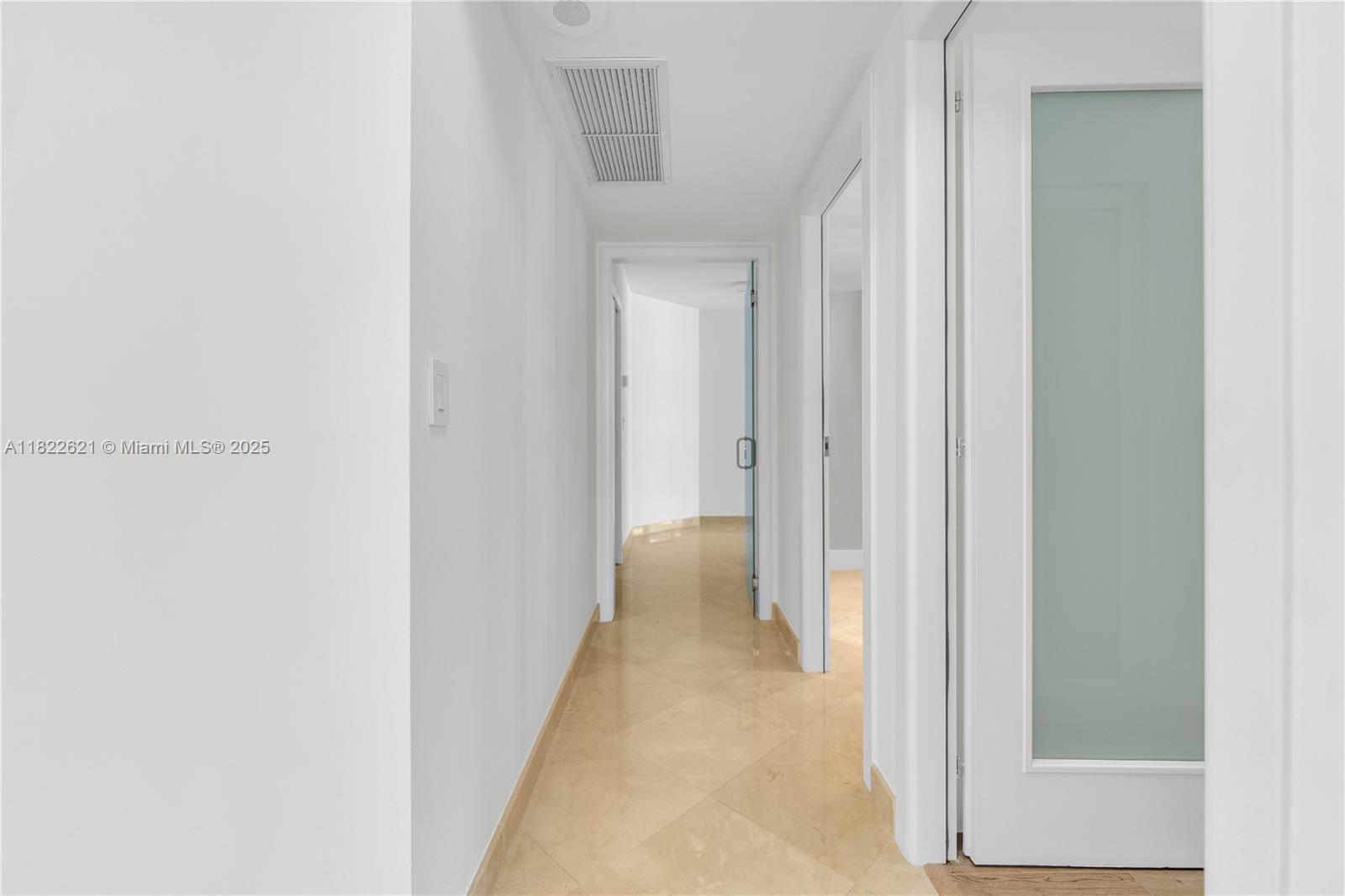 9801 Collins Avenue, Unit 16Y Bal Harbour, FL 33154 - Photo 5 of 17 a view of a hallway with a wooden table