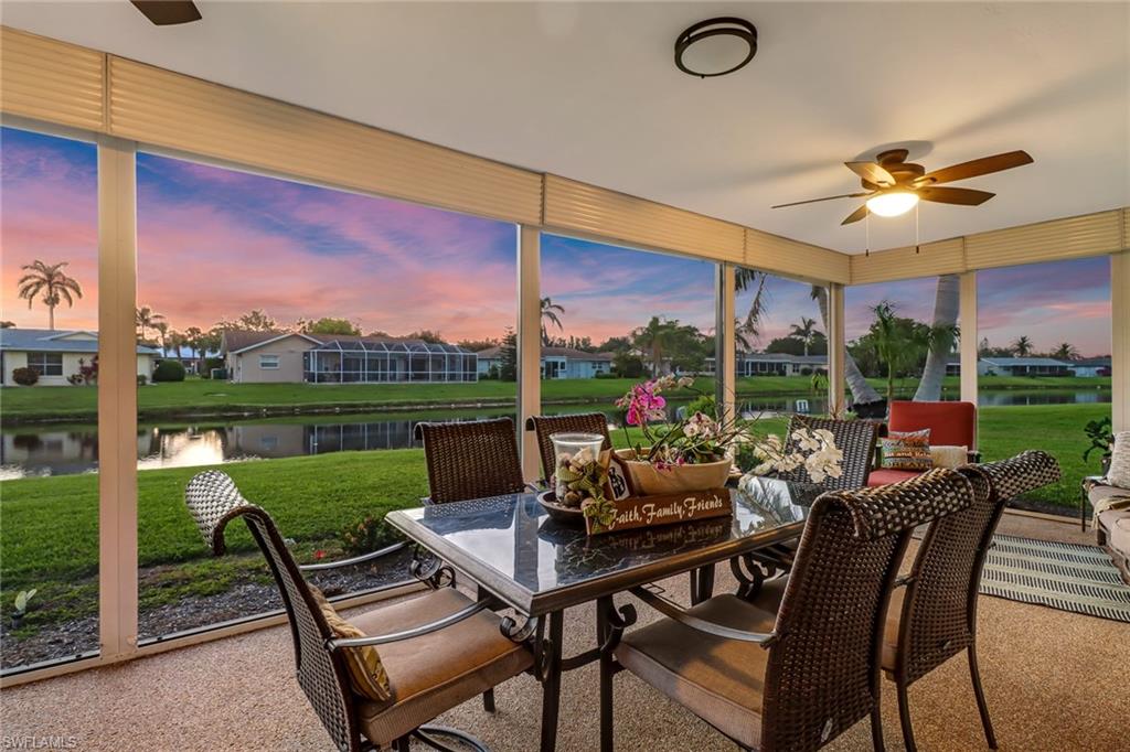 4576 Eagle Key Circle Naples, FL 34112 - Photo 16 of 18 a view of a patio with a dining table and chairs