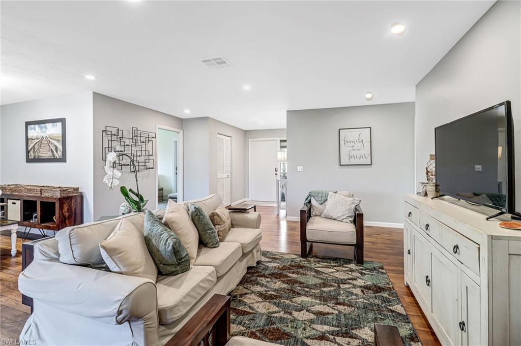 4576 Eagle Key Circle Naples, FL 34112 - Photo 5 of 18 a living room with furniture and a flat screen tv