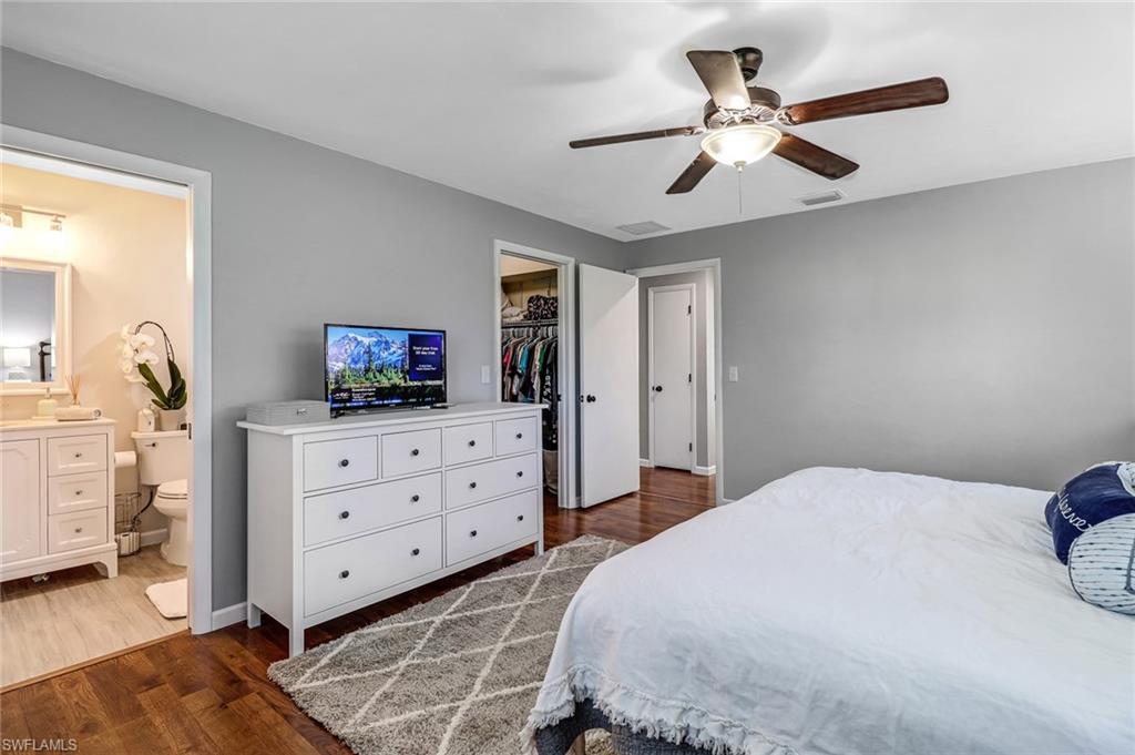 4576 Eagle Key Circle Naples, FL 34112 - Photo 7 of 18 a bedroom with a bed and a dresser in it