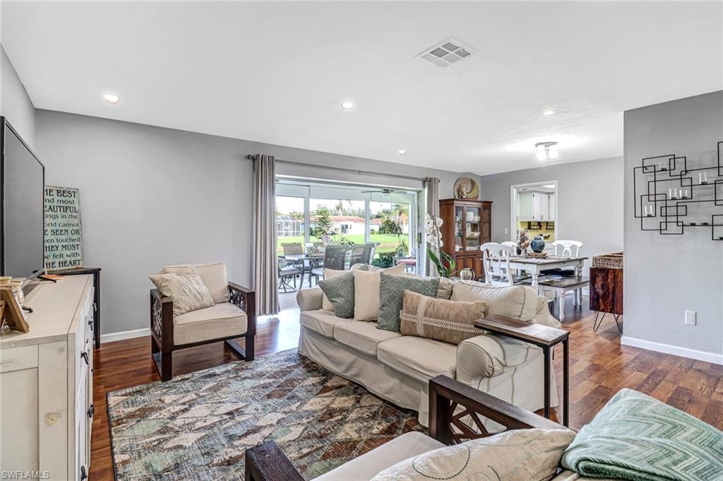 4576 Eagle Key Circle Naples, FL 34112 - Photo 10 of 18 a living room with furniture and a rug