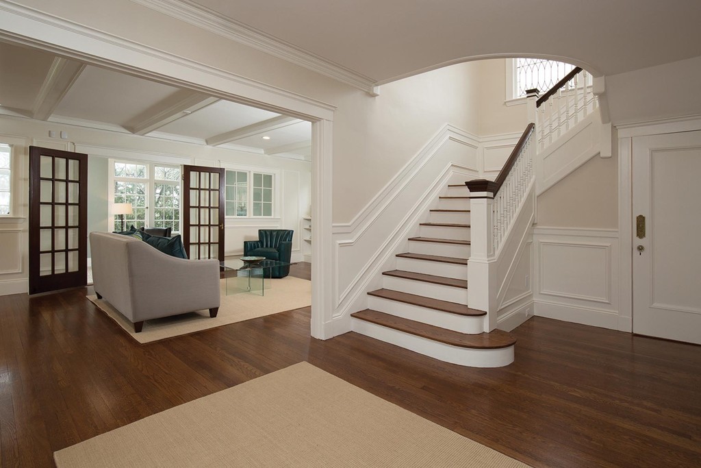 131 Dunster Road Boston, MA 02130 - Photo 2 of 13 a view of a livingroom with wooden floor and stairs