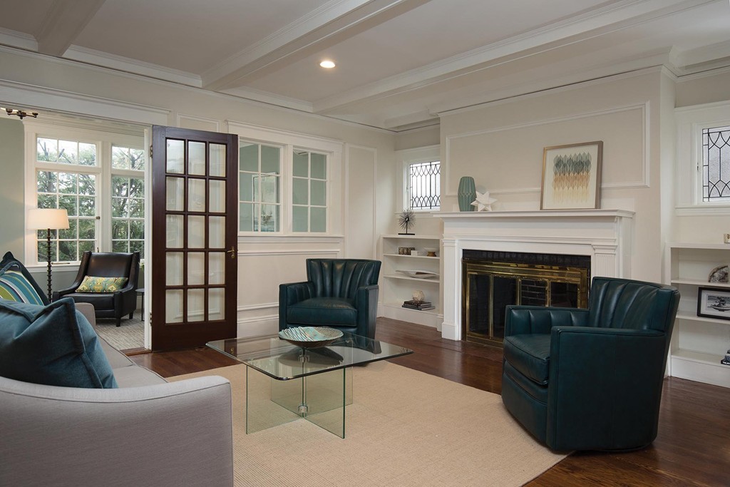 131 Dunster Road Boston, MA 02130 - Photo 3 of 13 a living room with furniture and a fireplace