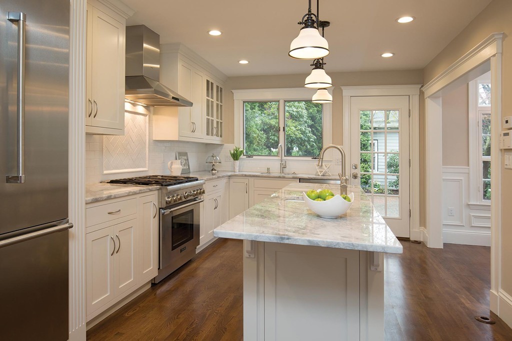 131 Dunster Road Boston, MA 02130 - Photo 5 of 13 a kitchen with stainless steel appliances granite countertop wooden cabinets a stove a sink and a refrigerator