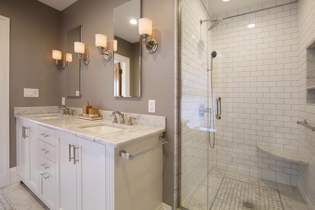 131 Dunster Road Boston, MA 02130 - Photo 7 of 13 a bathroom with a granite countertop shower sink vanity and mirror