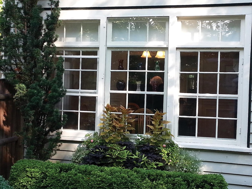 131 Dunster Road Boston, MA 02130 - Photo 9 of 13 a front view of a house with a window and a yard