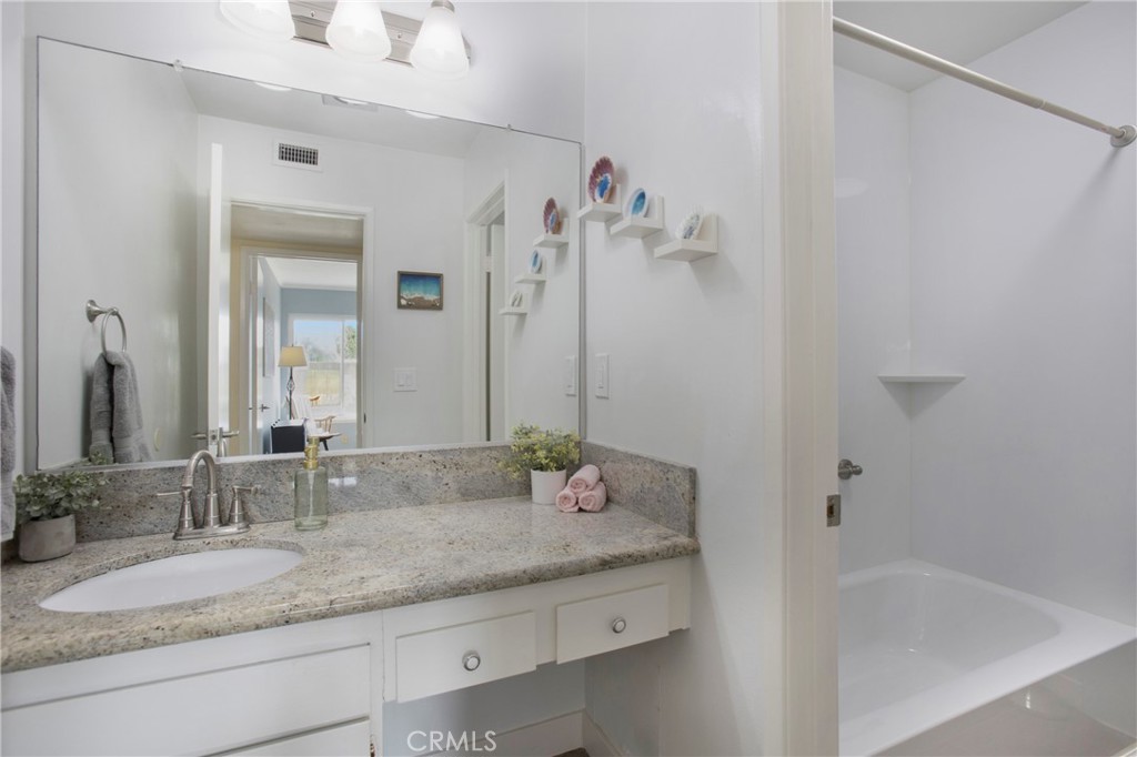 1936 Skywood Street Brea, CA 92821 - Photo 13 of 32 a bathroom with a granite countertop sink and a mirror