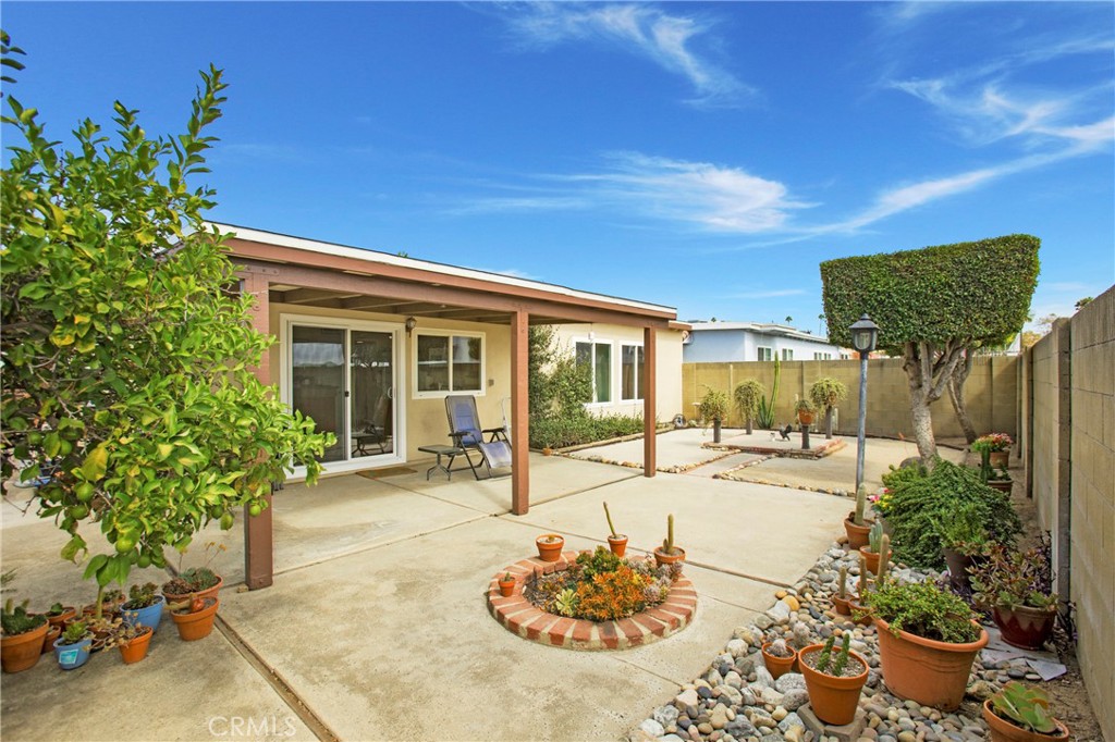 1936 Skywood Street Brea, CA 92821 - Photo 18 of 32 a view of a backyard with table and chairs and potted plants