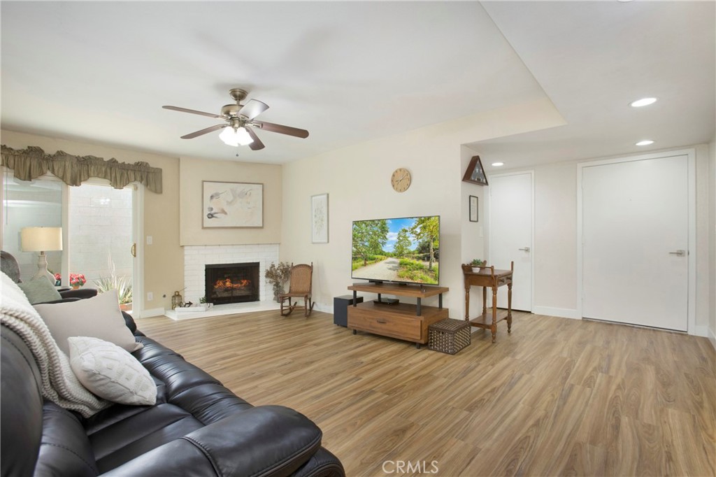 1936 Skywood Street Brea, CA 92821 - Photo 2 of 32 a living room with furniture a fireplace and a flat screen tv