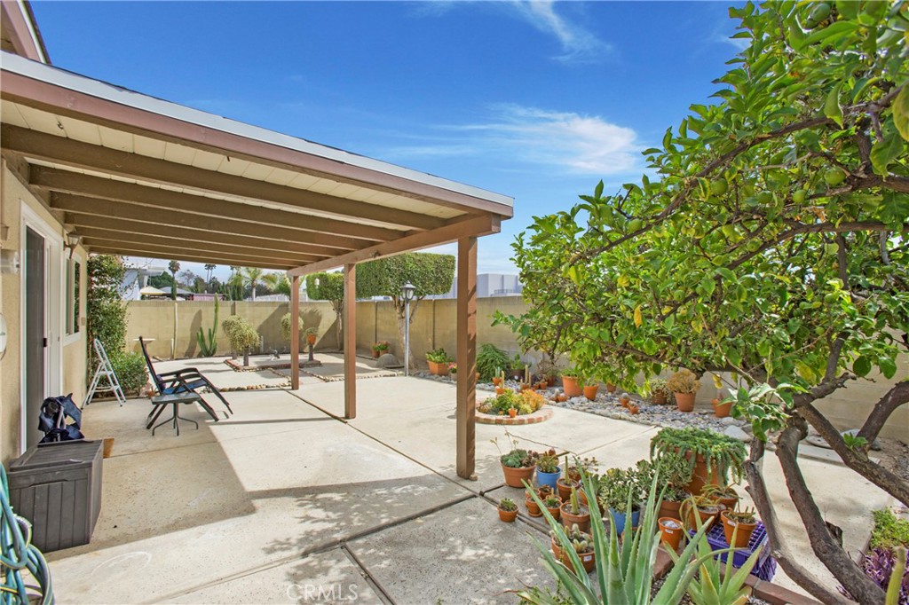 1936 Skywood Street Brea, CA 92821 - Photo 21 of 32 a view of a patio with table and chairs potted plants with floor to ceiling window and potted plants