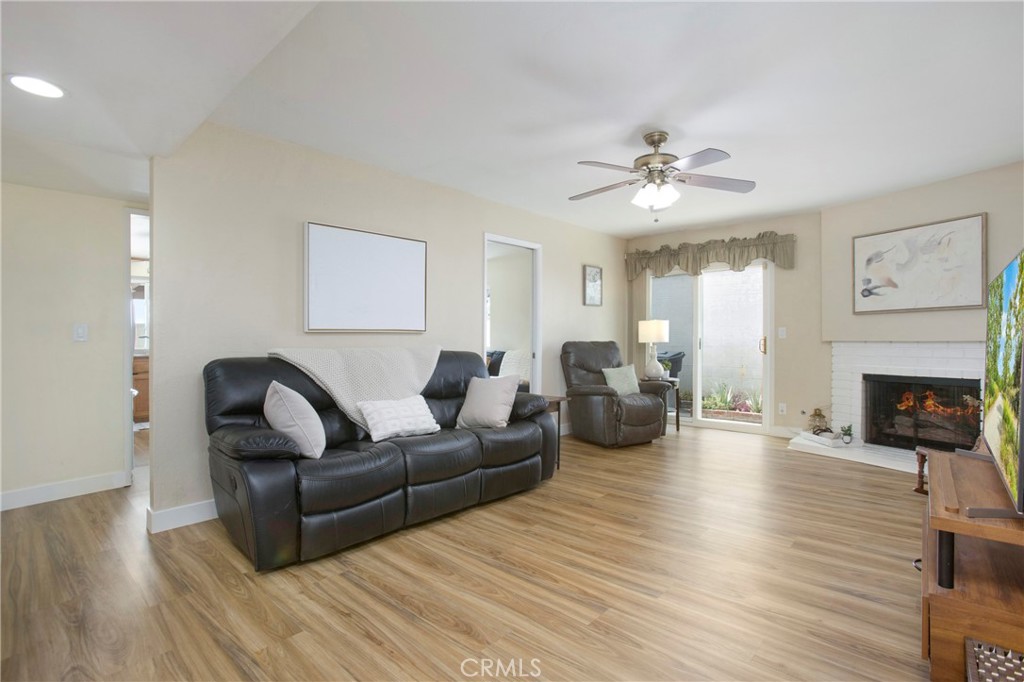 1936 Skywood Street Brea, CA 92821 - Photo 3 of 32 a living room with furniture a fireplace and wooden floor