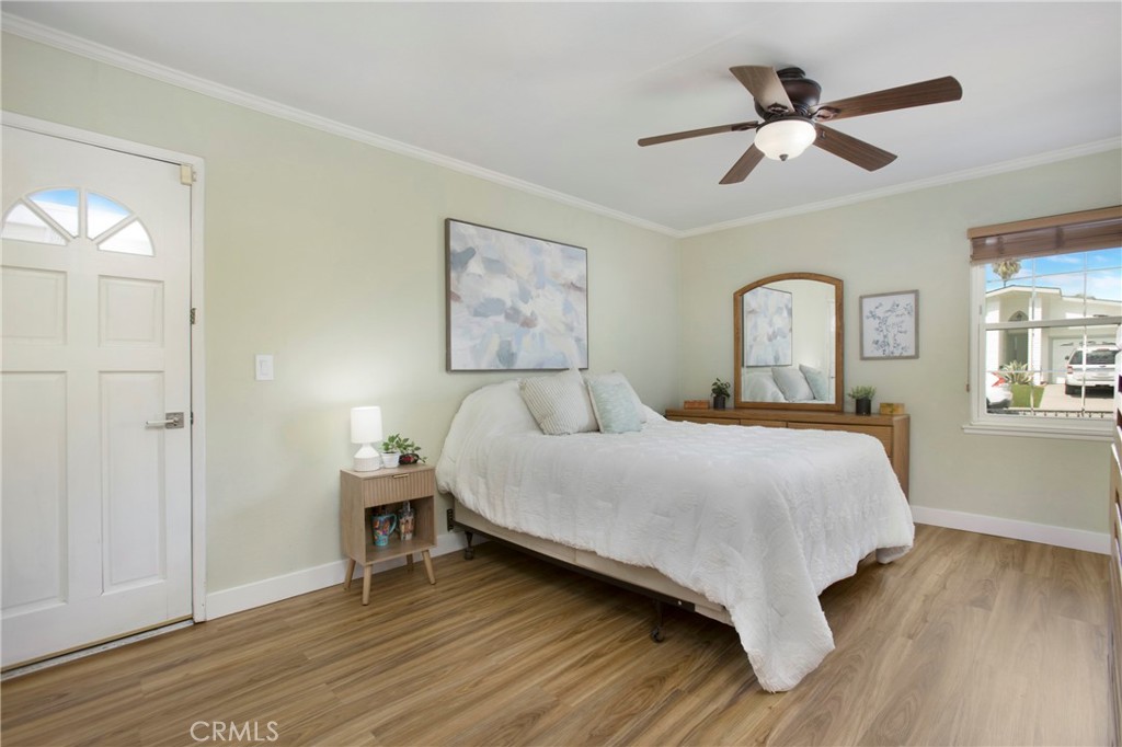 1936 Skywood Street Brea, CA 92821 - Photo 6 of 32 a bedroom with a bed and a large mirror with wooden floor