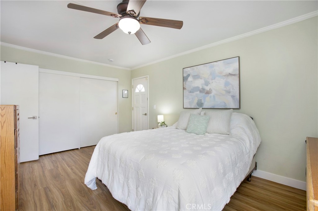 1936 Skywood Street Brea, CA 92821 - Photo 7 of 32 a bedroom with a large bed and a chandelier