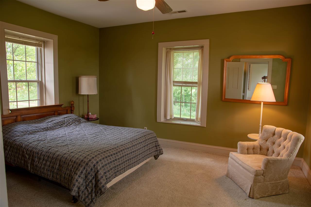 27815 Georgetown Road Shannon, IL 61078 - Photo 24 of 33 a bedroom with a bed and a couch