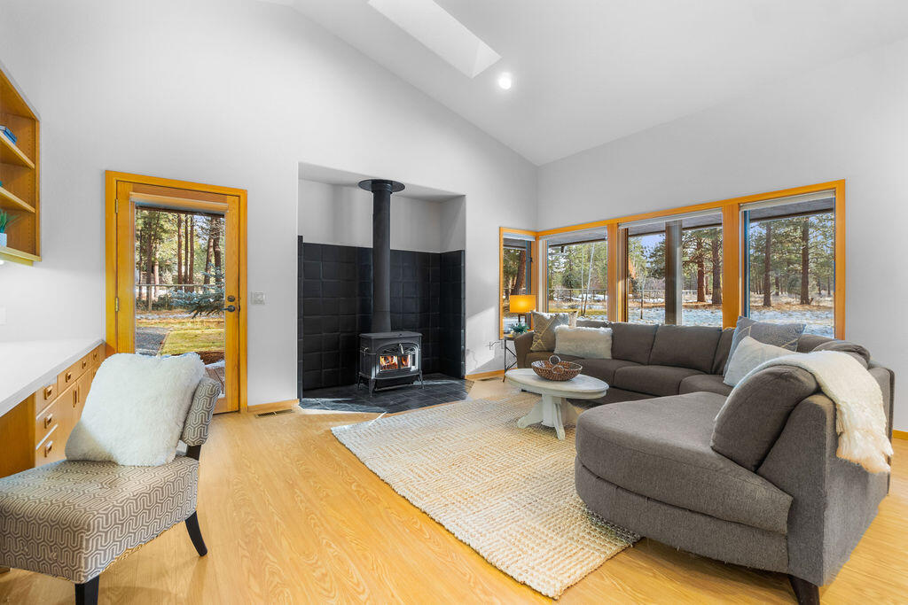 60013 West Ridgeview Drive Bend, OR 97702 - Photo 17 of 43 Cozy wood stove, efficient built-in workspace and access out to the side deck and dog run area.