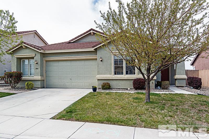 10441 Blockade Drive Reno, NV 89521 - Photo 1 of 1 a front view of a house with a yard