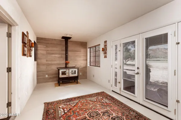 a bedroom with furniture and wooden floor