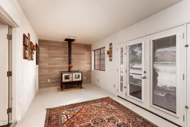 a bedroom with furniture and wooden floor