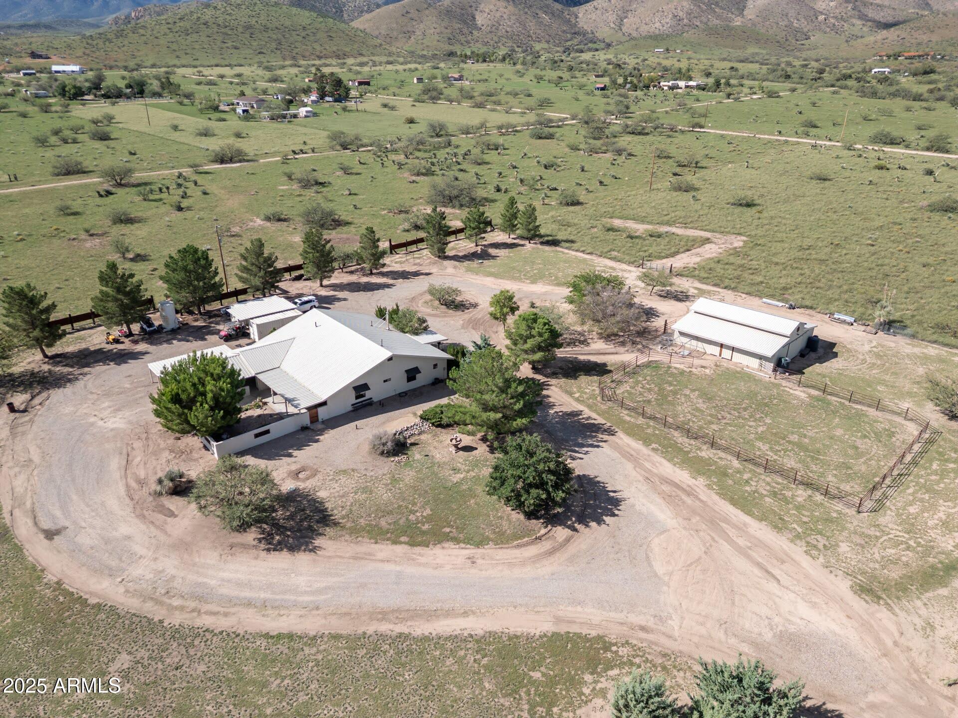 712 West Treasure Road Pearce, AZ 85625 - Photo 2 of 38 an aerial view of a house with a yard