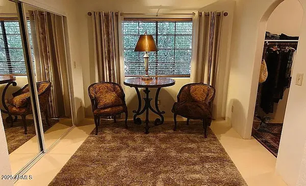 a living room with furniture and a window