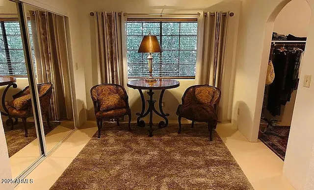 a living room with furniture and a window