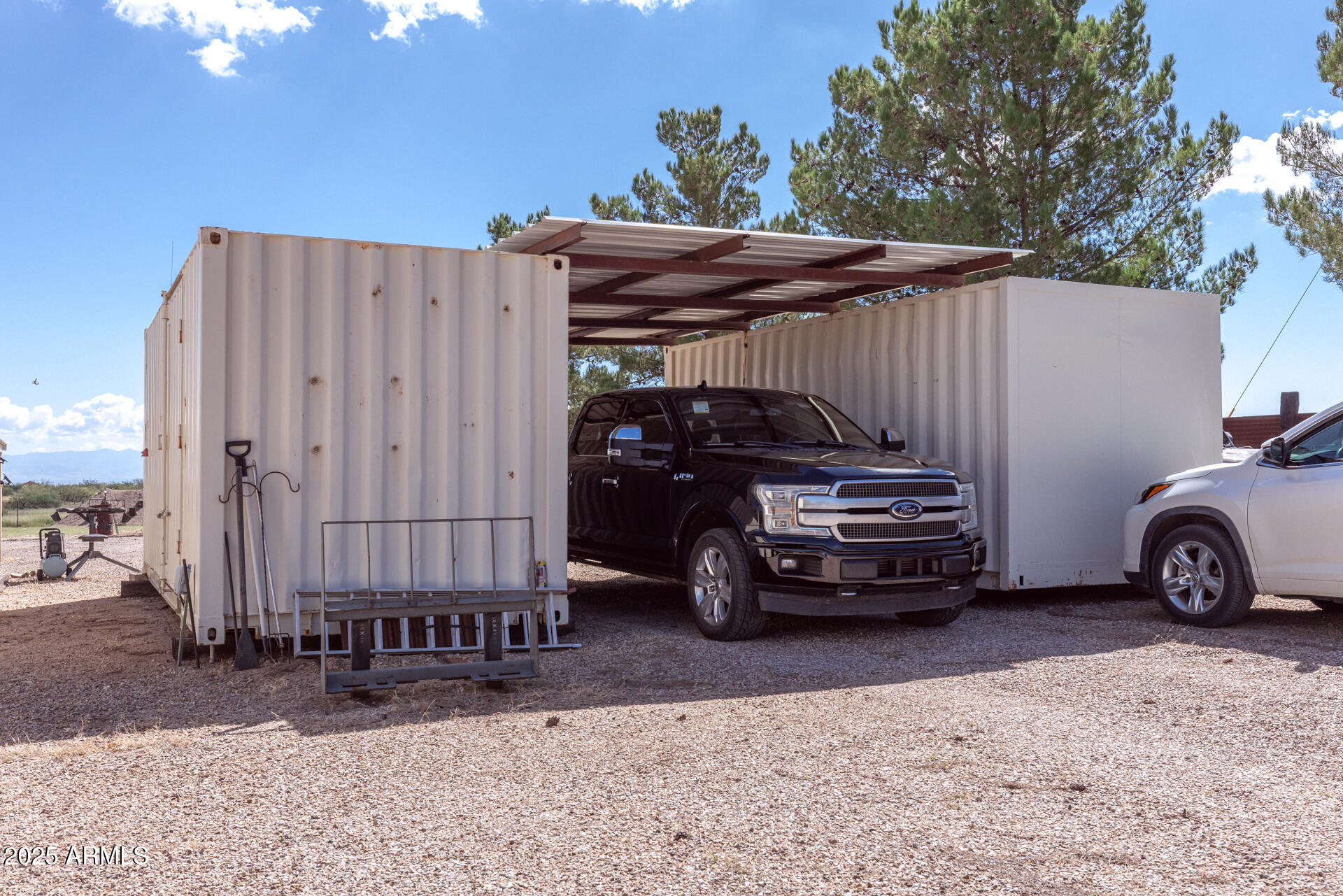 712 West Treasure Road Pearce, AZ 85625 - Photo 34 of 38 a view of a car in back of a house